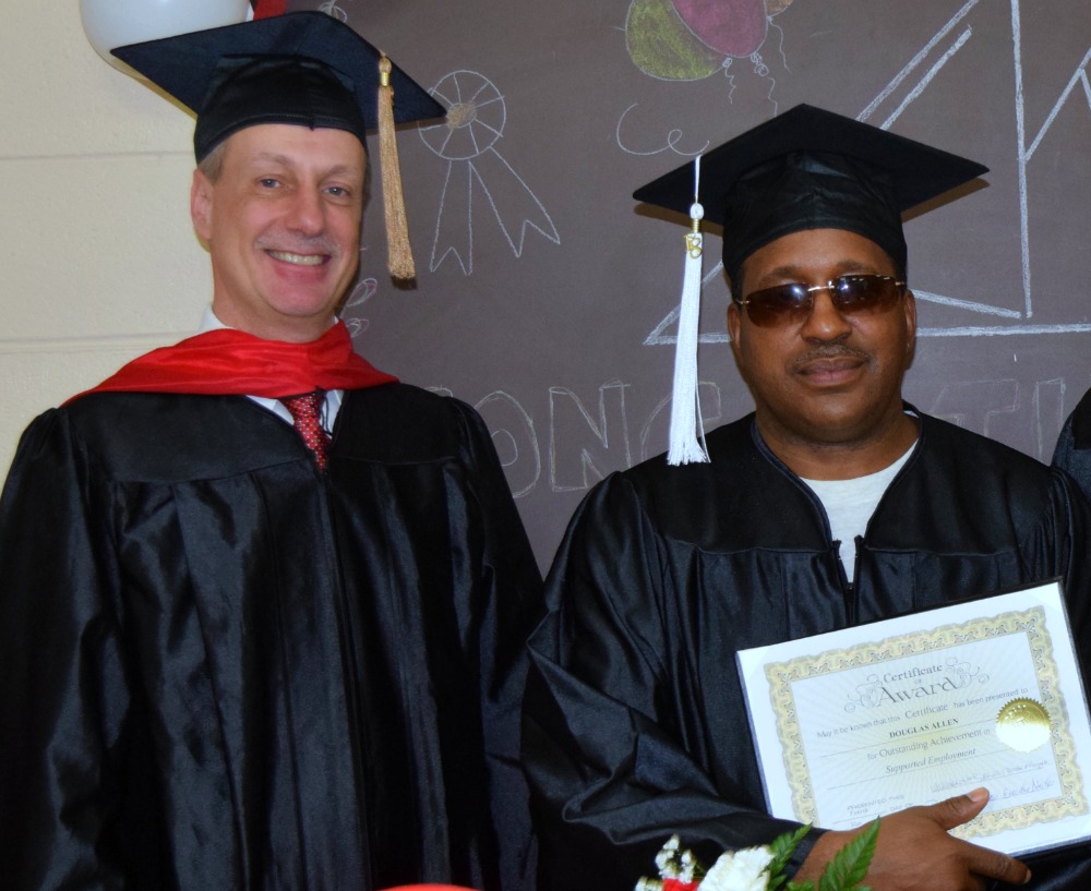 Executive Director Randy Strunk with a new IKRON graduate.